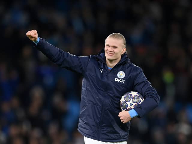 Erling Haaland of Manchester City celebrates victory with their match ball after scoring a hat-trick. (Getty Images)