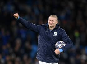 Erling Haaland of Manchester City celebrates victory with their match ball after scoring a hat-trick. (Getty Images)