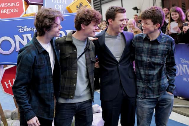 Tom Holland with his brothers (Pic:Getty)