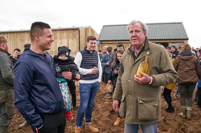 Jeremy Clarkson with visitors at Diddly Squat Farm Shop (Image by Amazon Press Studios) 