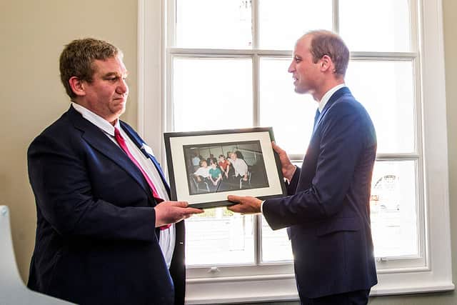 Prince William was presented in 2006 with a photograph of him, Prince Harry and his late mother Princess Diana taken at the homeless charity The Passage back in 1994. (Photo by Eamonn M. McCormack - WPA Pool/Getty Images)