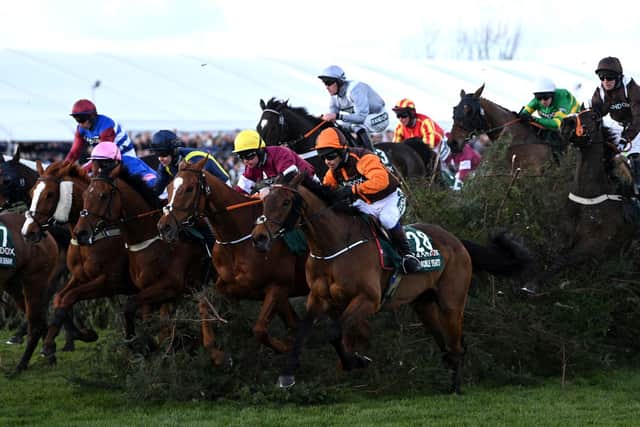 The horses race through The Chair in 2022 Grand National
