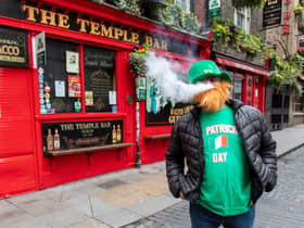 A man vapes outside a pub in the popular Temple bar area of Dublin on St Patrick’s Day. Picture: PAUL FAITH/AFP via Getty Images