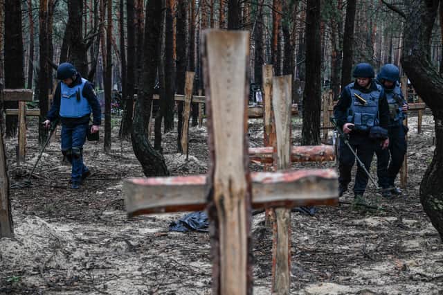 A UN-backed inquiry has conculded that Russia has committed war crimes in Ukraine, with evidence such as the mass grave sites in Bucha and Izyum. (Credit: Getty Images)