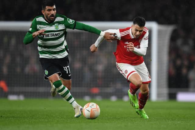 Gabriel Martinelli of Arsenal breaks past Ricardo Esgaio of Sporting during the UEFA Europa League round of 16 leg two match between Arsenal FC and Sporting CP at Emirates Stadium on March 16, 2023 in London, England. (Photo by Stuart MacFarlane/Arsenal FC via Getty Images)