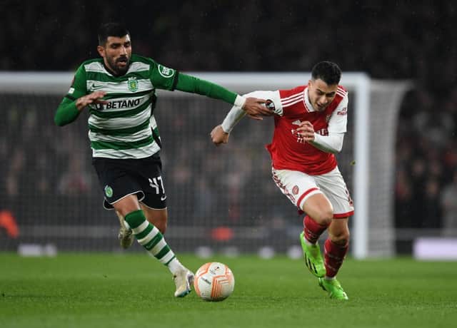 Gabriel Martinelli of Arsenal breaks past Ricardo Esgaio of Sporting during the UEFA Europa League round of 16 leg two match between Arsenal FC and Sporting CP at Emirates Stadium on March 16, 2023 in London, England. (Photo by Stuart MacFarlane/Arsenal FC via Getty Images)