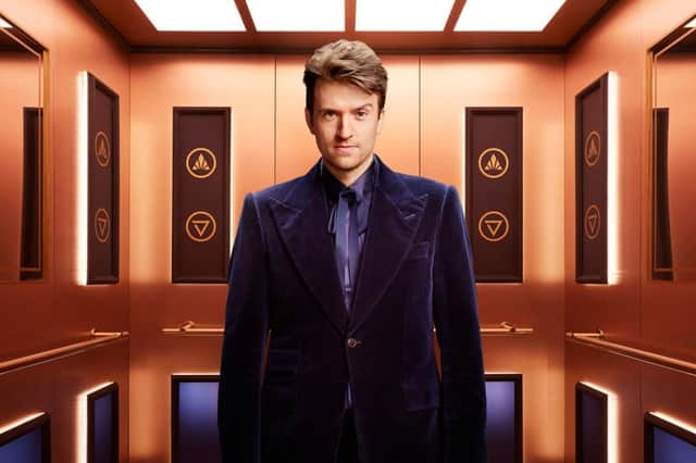 Rise and Fall host Greg James, pictured in the gold elevator (Credit: Channel 4)