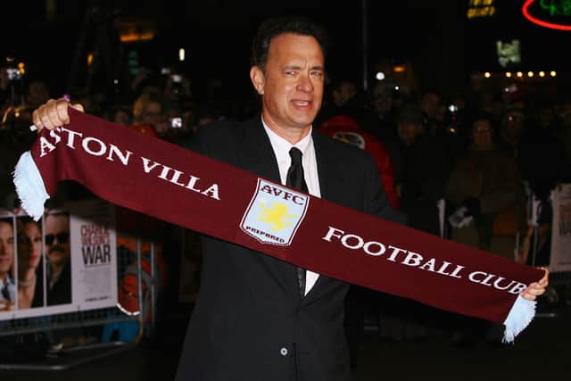 LONDON - JANUARY 09:  Actor Tom Hanks holds up an Aston Villa footbal club scarf as he arrives at the European Premiere of "Charlie Wilson's War" at the Empire cinema, Leicester Square on January 9, 2008 in London, England.  (Photo by Gareth Cattermole/Getty Images)