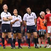 Referee Nic Berry makes a decision whilst looking at the TMO with assistants Wayne Barnes (l) and Chris Busby during the Guinness Six Nations match between Wales and Scotland at Principality Stadium on February 12, 2022 in Cardiff, Wales. (Photo by Stu Forster/Getty Images)