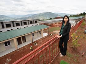 Home Secretary Suella Braverman tours a building site on the outskirts of Kigali during her visit to Rwanda, to see the houses being constructed to potentially house deported migrants from the UK. Picture date: Saturday March 18, 2023. Credit: PA