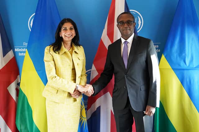 Home Secretary Suella Braverman shakes hands with Rwandan minister for foreign affairs and international co-operation, Vincent Biruta in Kigali, during her visit to Rwanda. Picture date: Saturday March 18, 2023. Credit: PA