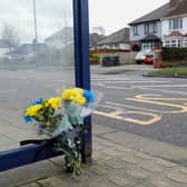 Flowers left at the scene after 15-year-old girl has died after being struck by a bus. Picture: SWNS