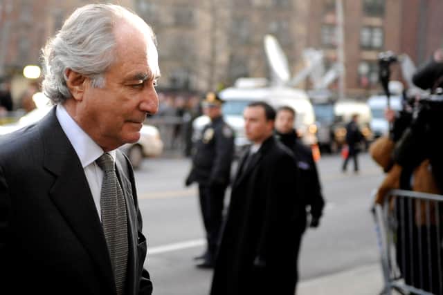 Financier Bernard Madoff arrives at Manhattan Federal court on March 12, 2009 in New York City. Madoff is scheduled to enter a guilty plea on 11 felony counts which under federal law can result in a sentence of about 150 years.  (Photo by Stephen Chernin/Getty Images)