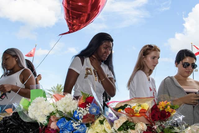 Fans pay tribute at a makeshift memorial for XXXTentacion (Photo: Jason Koerner/Getty Images)