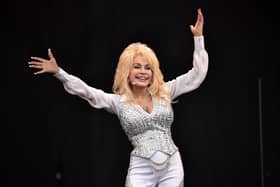 US country music singer Dolly Parton performs on the Pyramid Stage, on the final day of the Glastonbury Festival of Music and Performing Arts on Worthy Farm in Somerset, southwest England, on June 29, 2014.  AFP PHOTO / LEON NEAL (Photo by LEON NEAL / AFP) (Photo by LEON NEAL/AFP via Getty Images)