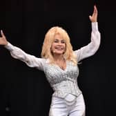 US country music singer Dolly Parton performs on the Pyramid Stage, on the final day of the Glastonbury Festival of Music and Performing Arts on Worthy Farm in Somerset, southwest England, on June 29, 2014.  AFP PHOTO / LEON NEAL (Photo by LEON NEAL / AFP) (Photo by LEON NEAL/AFP via Getty Images)