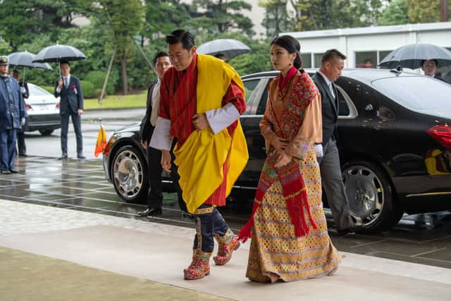 King Jigme Khesar Namgyel Wangchuck and Queen Jetsun Pema of Bhutan arrive to attend the Enthronement Ceremony Of Emperor Naruhito of Japan at the Imperial Palace on October 22, 2019 in Tokyo, Japan. (Photo by Carl Court/Getty Images)