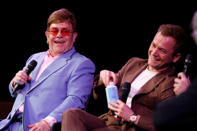 HOLLYWOOD, CALIFORNIA - JANUARY 04: Elton John and Taron Egerton speak onstage during a Special Screening Q&A moderated by Dave Karger  in support of Rocketman at the Paramount Theatre on January 04, 2020 in Hollywood, California. (Photo by Rachel Murray/Getty Images for Paramount Pictures)