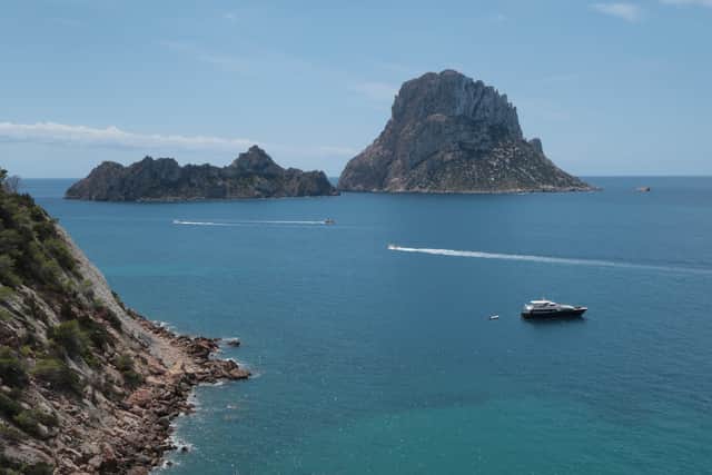IBIZA, SPAIN - AUGUST 11:  Es Vedra island (R) stands close to the island of Ibiza on August 11, 2017 near Sant Josep, Spain. Ibiza is a popular tourist destination.  (Photo by Sean Gallup/Getty Images)