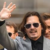US actor Johnny Depp gestures as he leaves the Hight Court after the final day of his libel trial against News Group Newspapers (NGN), in London, on July 28, 2020. (Photo by DANIEL LEAL/AFP via Getty Images)