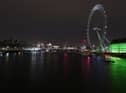 Lights switched off on the London Eye during Earth Hour. (Photo by JUSTIN TALLIS/AFP via Getty Images)