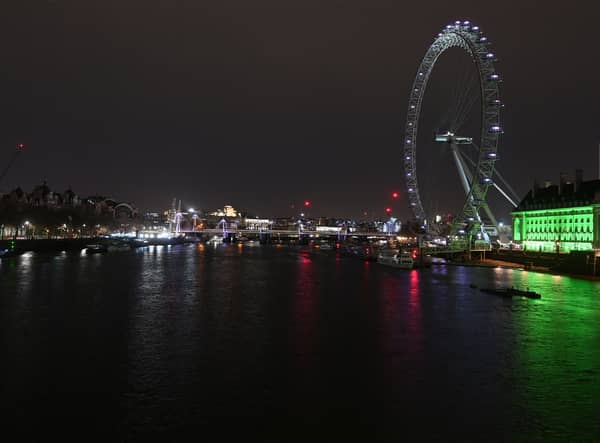 Lights switched off on the London Eye during Earth Hour. (Photo by JUSTIN TALLIS/AFP via Getty Images)