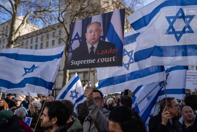 Protesters gathered outside Downing Street to demonstrate against Netenyahu's visit. (Credit: Getty Images) 