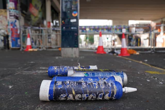 Nitrous oxide gas canisters littering the street. Picture: PA