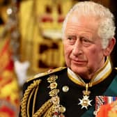 King Charles III gives recipients their honour or award in a special ceremony