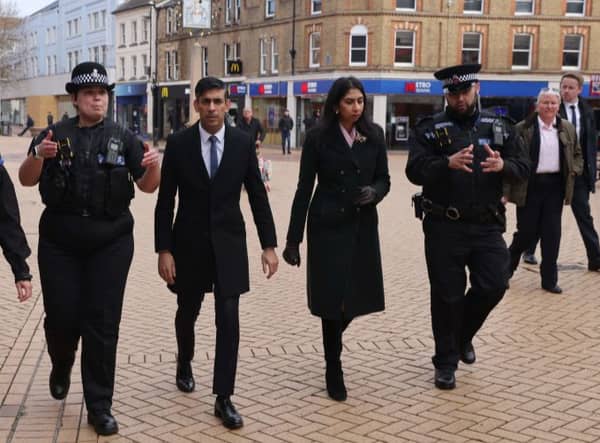 Britain’s Prime Minister Rishi Sunak and Britain’s Home Secretary Suella Braverman walk with police Sergeant Sophie Chesters and police Sergeant Matt Collins during a visit to Chelmsford. Credit: JACK HILL/POOL/AFP via Getty Images