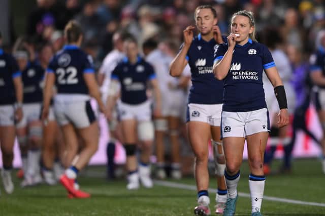 Scotland try-scorer Chloe Rollie reacts after another England try is scored
