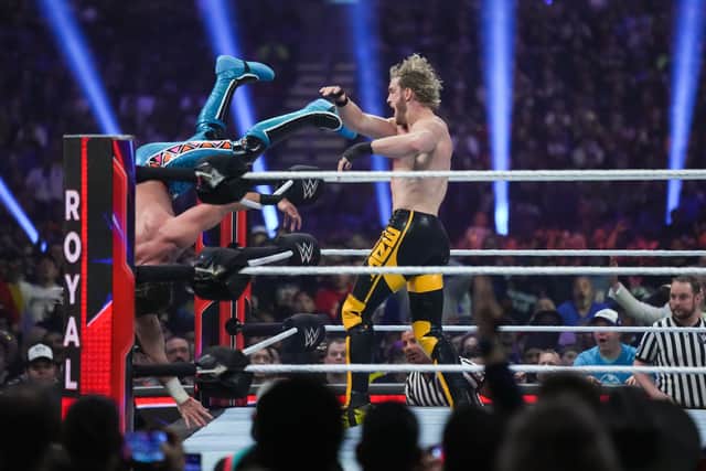 Logan Paul throws Seth Rollins out of the ring during the WWE Royal Rumble (Photo: Alex Bierens de Haan/Getty Images)
