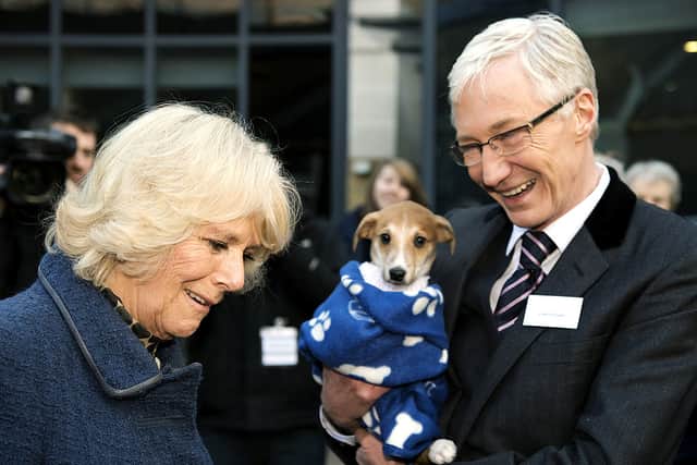 Camilla, Duchess of Cornwall speaks with television presenter Paul O’Grady during a visit to Battersea Dog and Cats Home on December 12, 2012 in London, England. (Photo by Adrian Dennis - WPA Pool/Getty Images)