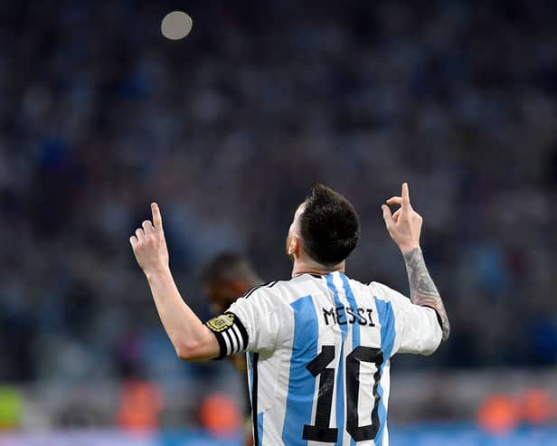 Messi celebrates scoring his 100th goal for Argentina against Curacao