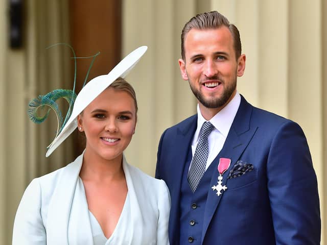 England football captain Harry Kane with his partner Kate Goodland after being made an MBE (Member of the Order of the British Empire) by the Duke of Cambridge at an investiture ceremony at Buckingham Palace on March 28, 2019 in London, England. (Photo by Victoria Jones WPA Pool/Getty Images)