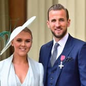 England football captain Harry Kane with his partner Kate Goodland after being made an MBE (Member of the Order of the British Empire) by the Duke of Cambridge at an investiture ceremony at Buckingham Palace on March 28, 2019 in London, England. (Photo by Victoria Jones WPA Pool/Getty Images)