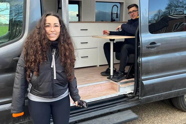 Husband and wife Robert and Mariona Bolohan proudly show off the van they have turned in to their home. Photo by Instagram / TikTok/ @theminibuscamper.