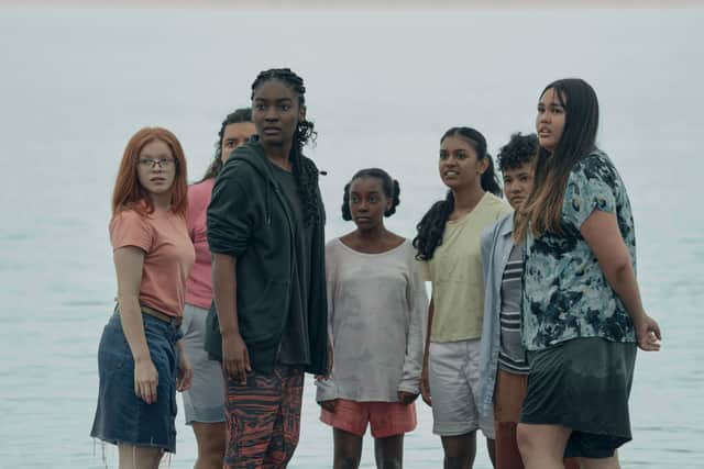 Halle Bush as Allie in The Power, surrounded by her acolytes (Credit: Katie Yu/Prime Video)