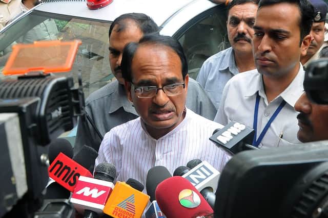 Indian Chief Minister of the state of Madhya Pradesh Shivraj Singh Chauhan talks to media outside the Ministry of External Affairs in New Delhi on July 8, 2015.  (Photo by STRDEL/AFP via Getty Images)