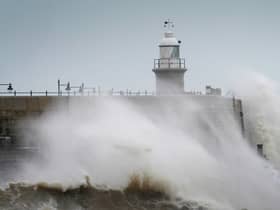 Waves crash against the harbour wall during strong winds in Folkestone, Kent (Photo: PA)