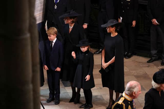 Kate Middleton, alongside Meghan Markle and two out of her three children, Prince George and Princess Charlotte at the funeral of Queen Elizabeth 11. Photograph by Getty