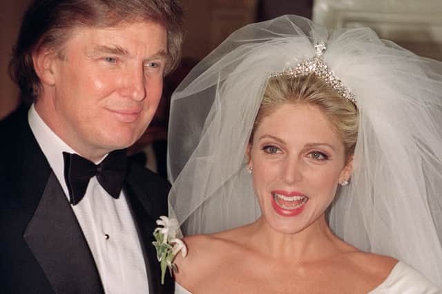 Donald Trump and Marla Maples after marrying in a private wedding ceremony at Trump’s Plaza Hotel, in New York in December 1993 (Photo: BOB STRONG/AFP via Getty Images)