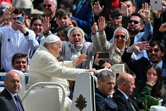 Pope Francis blesses the faithful as he tours St. Peter’s square after Palm Sunday mass (Photo:  FILIPPO MONTEFORTE/AFP via Getty Images)