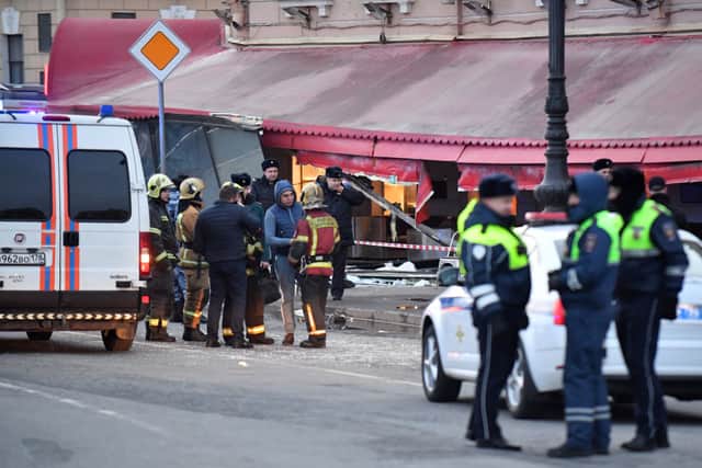 Russian police investigators inspect a damaged ‘Street bar’ cafe in a blast in Saint Petersburg (Photo: AFP via Getty Images)
