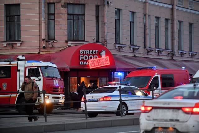 Russian police investigators inspect a damaged ‘Street bar’ cafe (Photo: AFP via Getty Images)