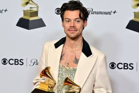 English singer-songwriter Harry Styles poses with the awards for Album Of The Year for "Harrys House" and Best Pop Vocal Album for "Harrys House" 