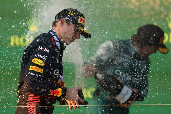 Max Verstappen and Fernando Alonso celebrate first and third places following chaotic Australian GP