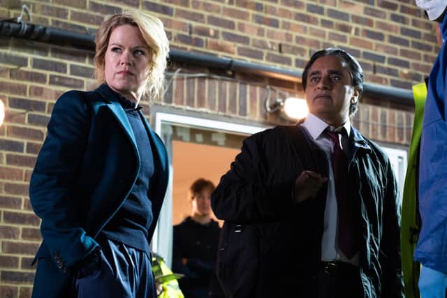 Sinéad Keenan as DCI Jessica James and Sanjeev Bhaskar as DI Sunny Khan in Unforgotten S5, investigating a crime scene at night (Credit: ITV)
