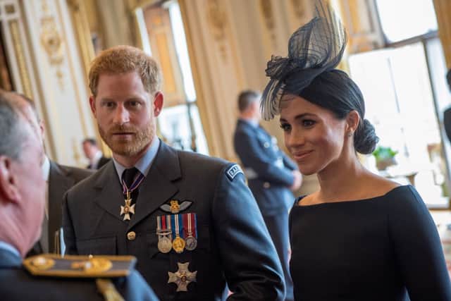 Meghan Markle wore a black Dior Dior dress to the RAF Centenary Service. (Photo by Chris J Ratcliffe - WPA Pool / Getty Images)