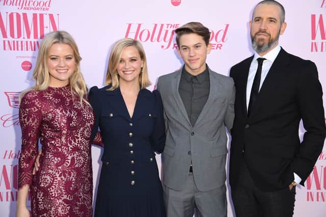Ava Phillippe, honoree Reese Witherspoon, Deacon Reese Phillippe, and talent agent at CAA Jim Toth attend the Hollywood Reporters annual Women in Entertainment Breakfast Gala, on December 11, 2019 at Milk Studios in Hollywood, California. (Photo by Robyn Beck / AFP) (Photo by ROBYN BECK/AFP via Getty Images)